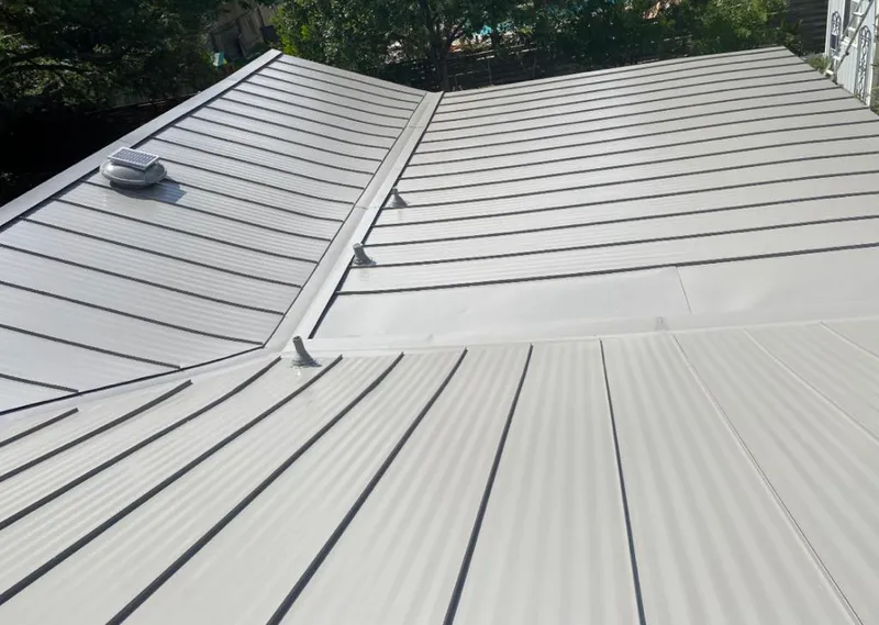 Solar attic fan installed on a metal roof for Roof Ventilation in Pittsburg